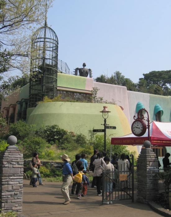 Entrance and exterior of the Studio Ghibli Museum in Mitaka, Tokyo, with visitors queuing at the gate